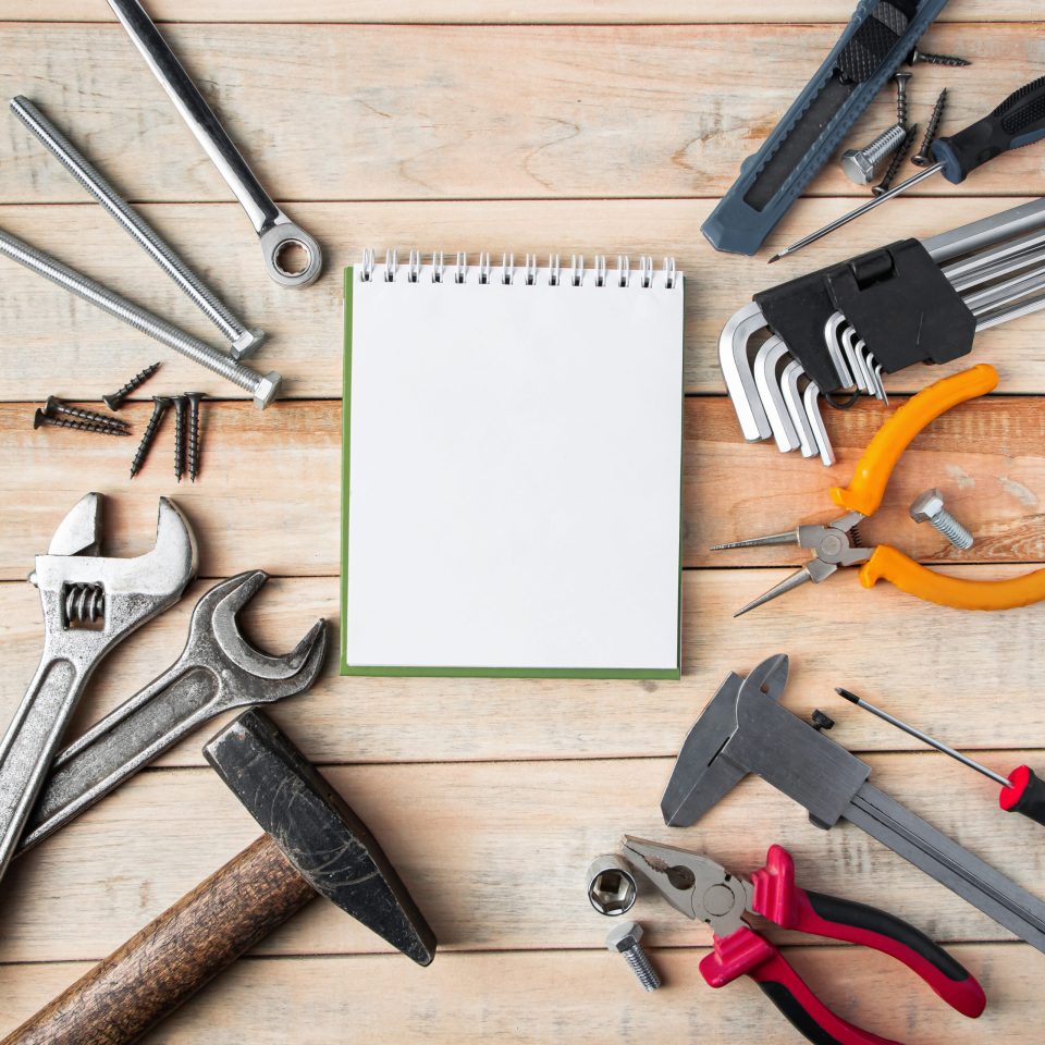 International Father's Day. Greeting card concept. Set of construction tools on a wooden background. Place for text.